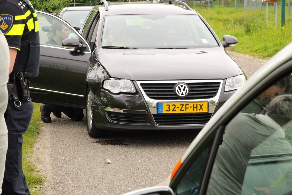 Schade bij botsing op rotonde