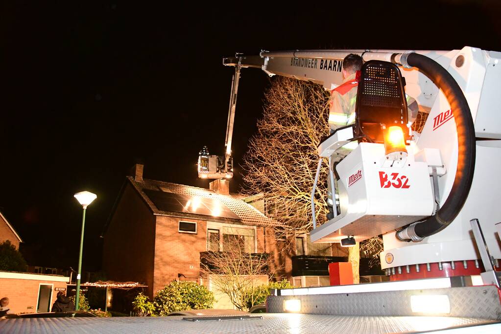 Woonkamer vol rook door schoorsteenbrand
