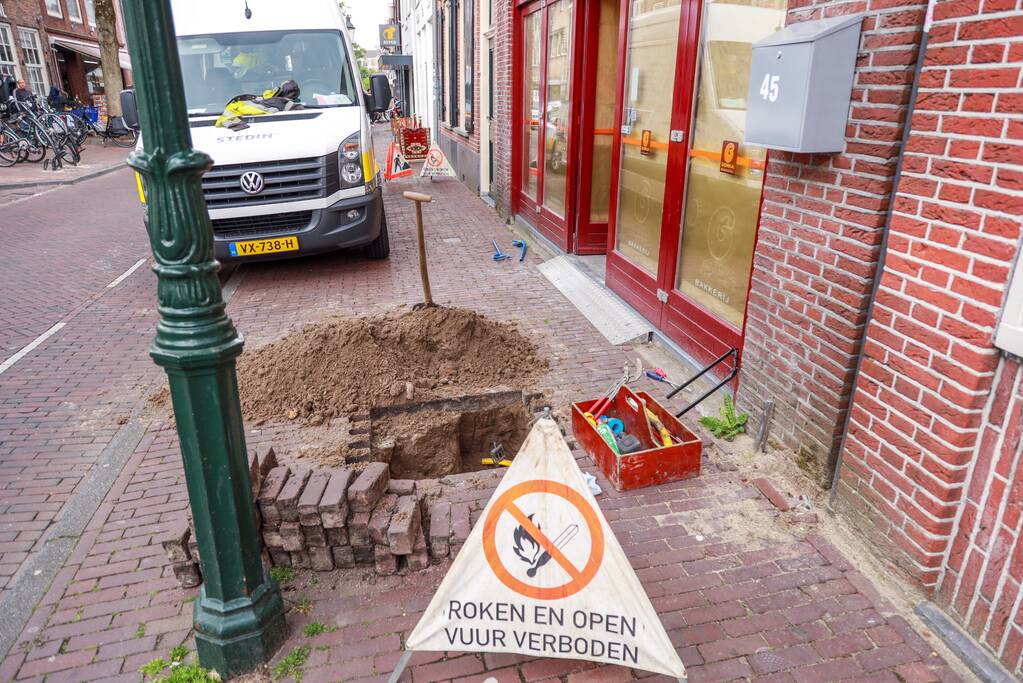 Opengebroken stoep door gaslek