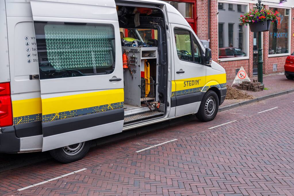 Opengebroken stoep door gaslek