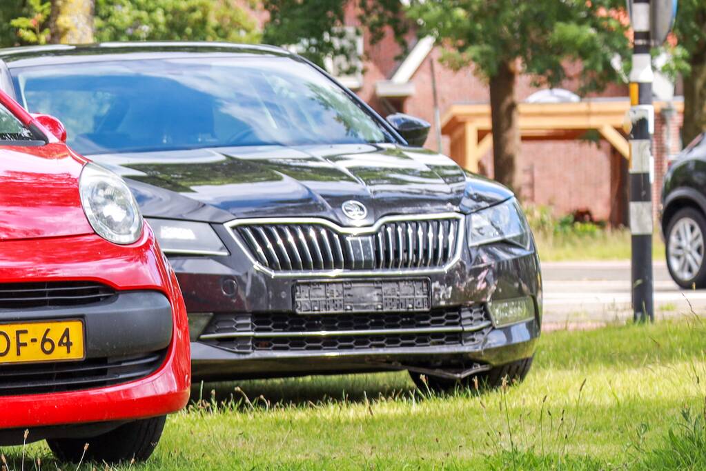 Schade na botsing op kruising