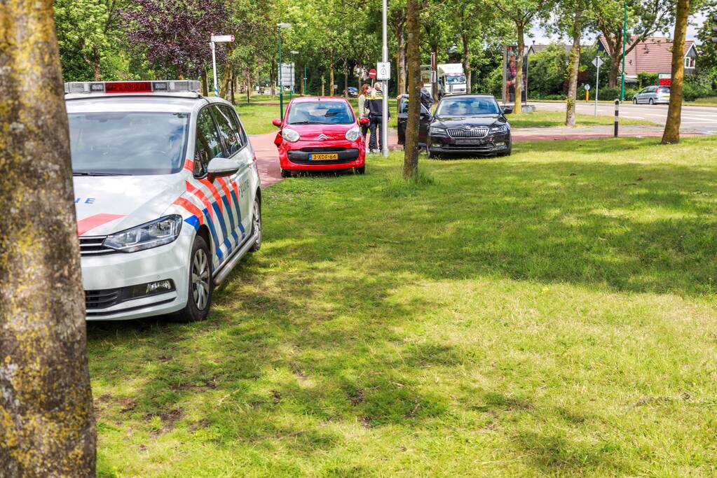 Schade na botsing op kruising