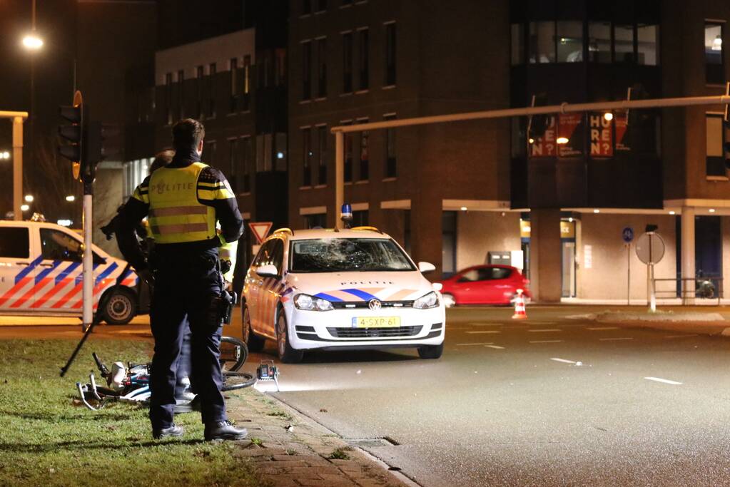 Fietsers aangereden door politieauto