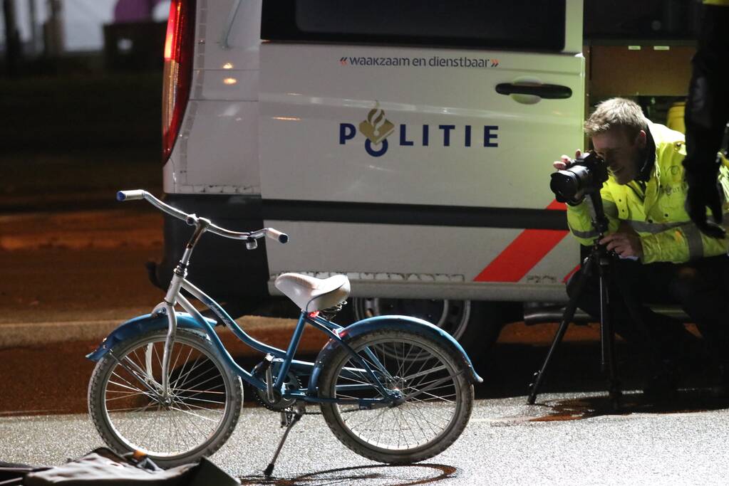 Fietsers aangereden door politieauto