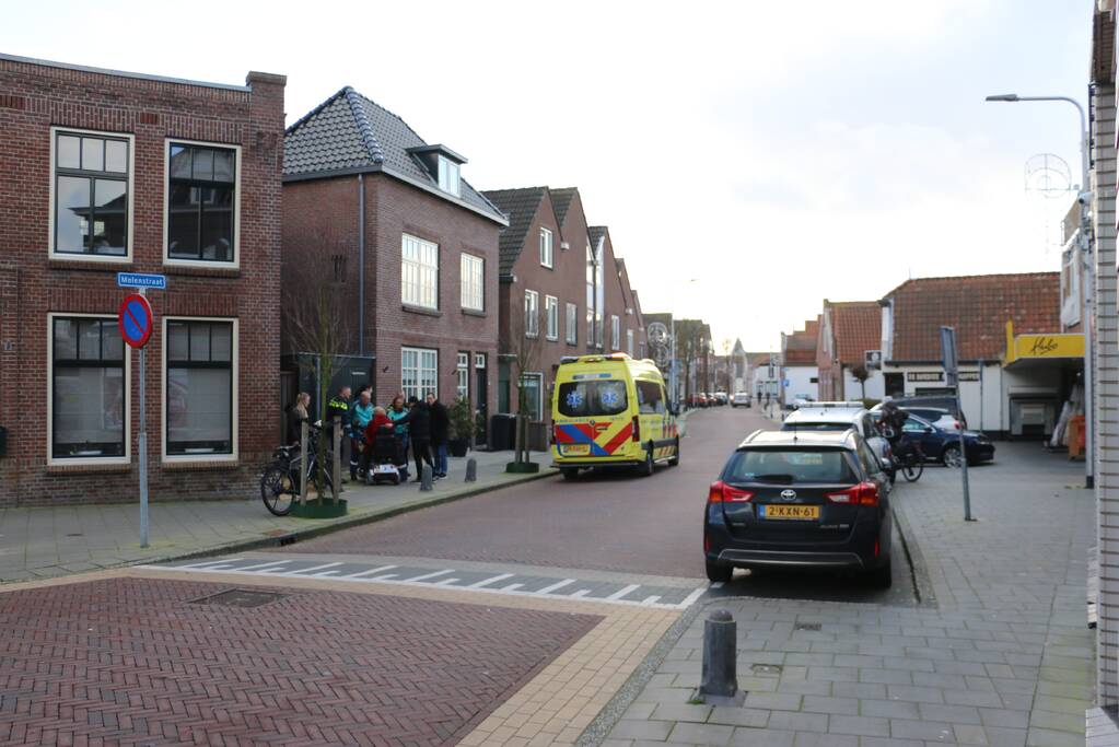 Persoon in scootmobiel ten val