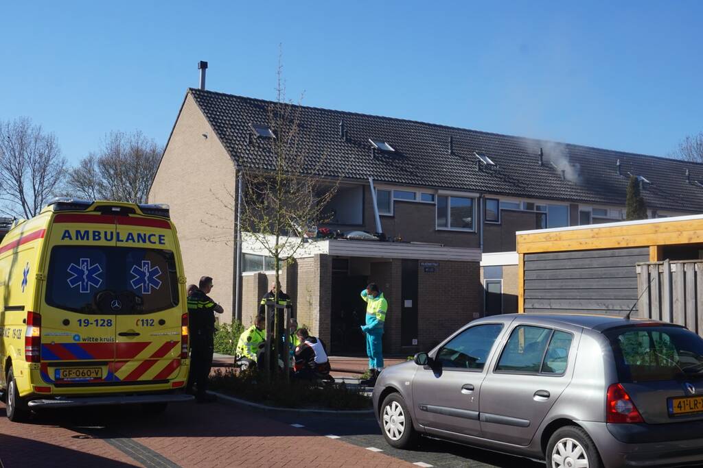 Man in boeien geslagen bij woningbrand