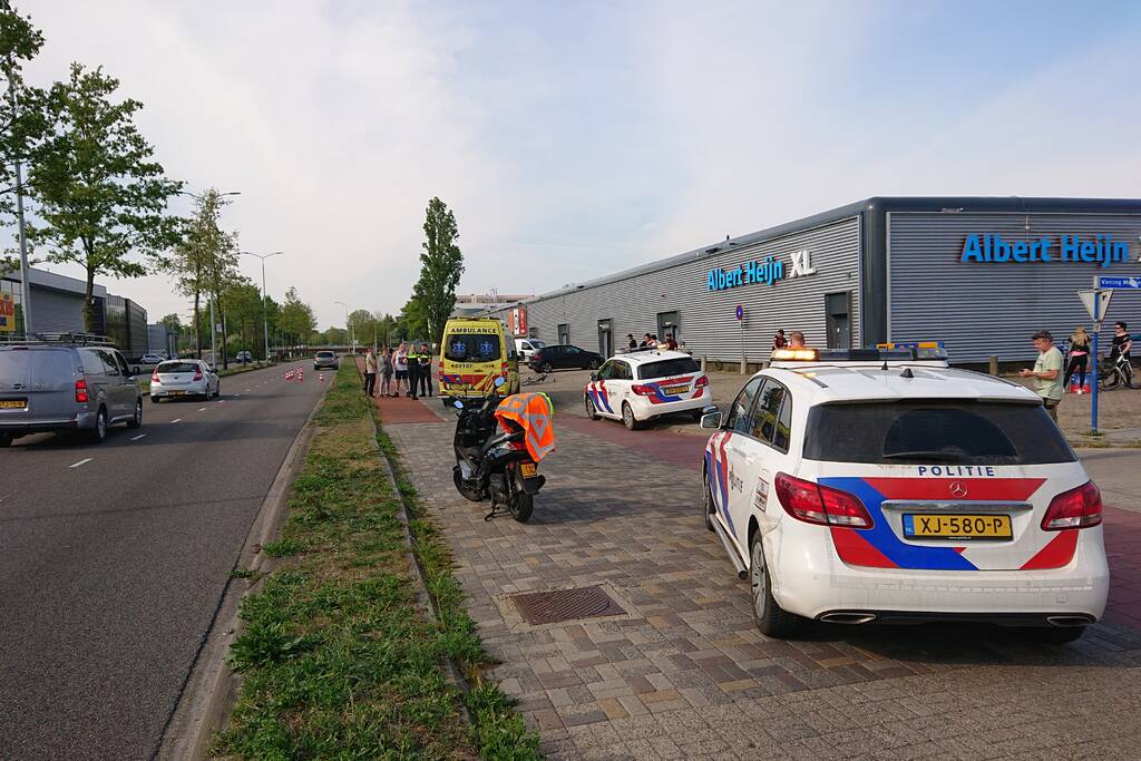 Scooter en fietser klappen op elkaar