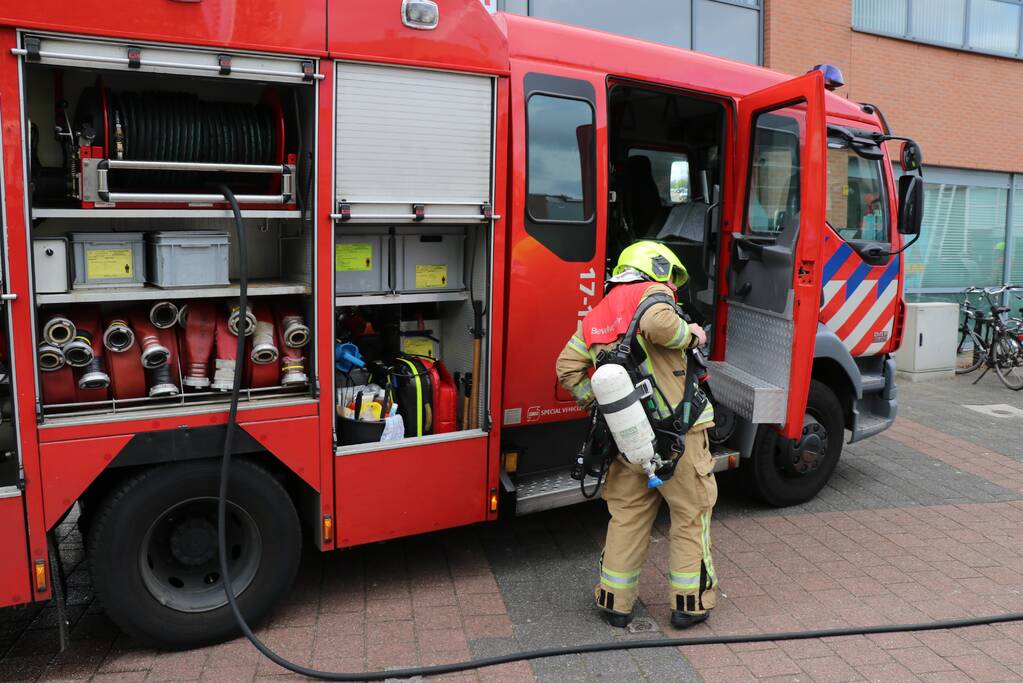 Brand in afvoerkanaal van winkel