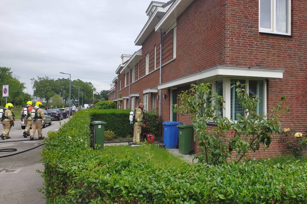 Brand in spouwmuur van woningen