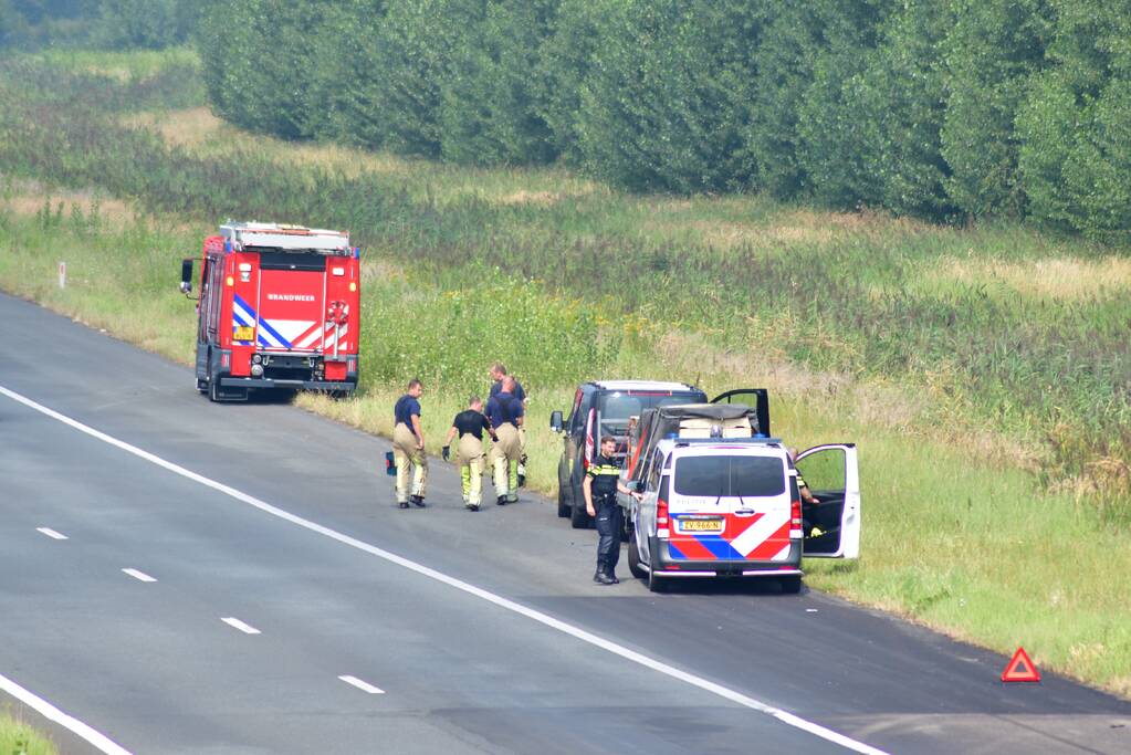 Bestuurder ziet rokende aanhanger