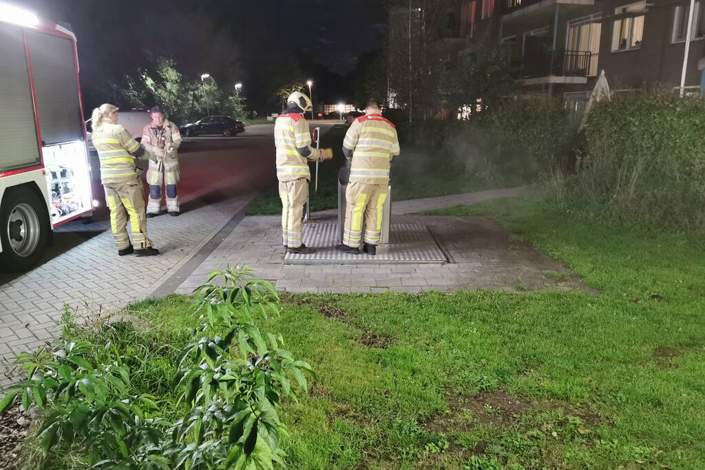Flinke brand in ondergrondse container