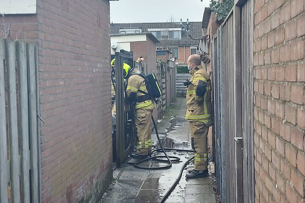 Schutting flink beschadigd door brand