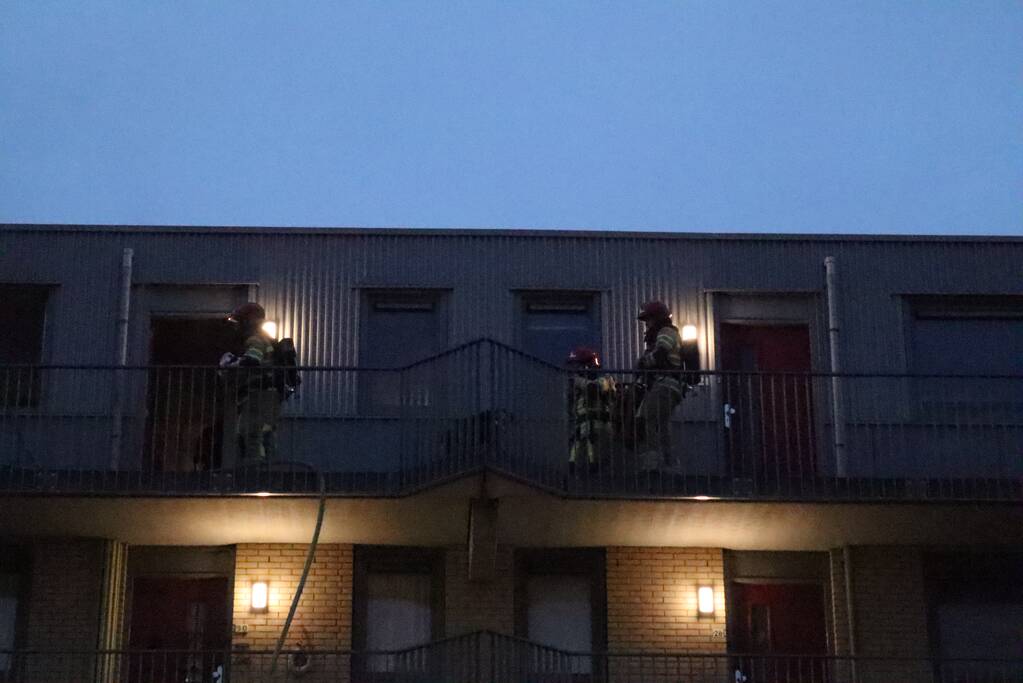 Brand in flatwoning boven winkels