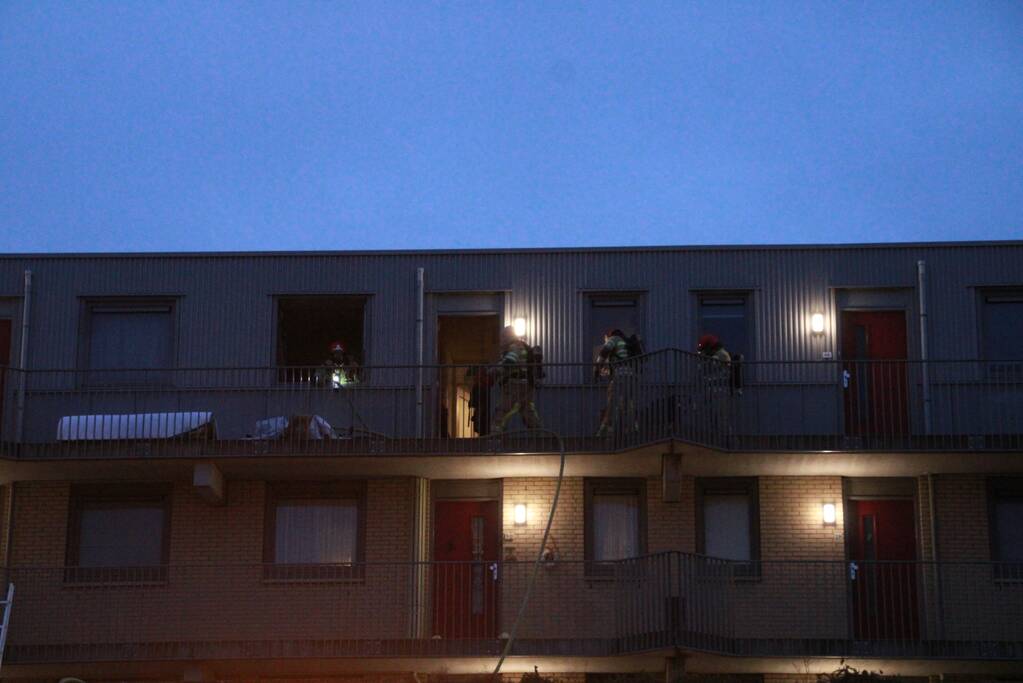 Brand in flatwoning boven winkels