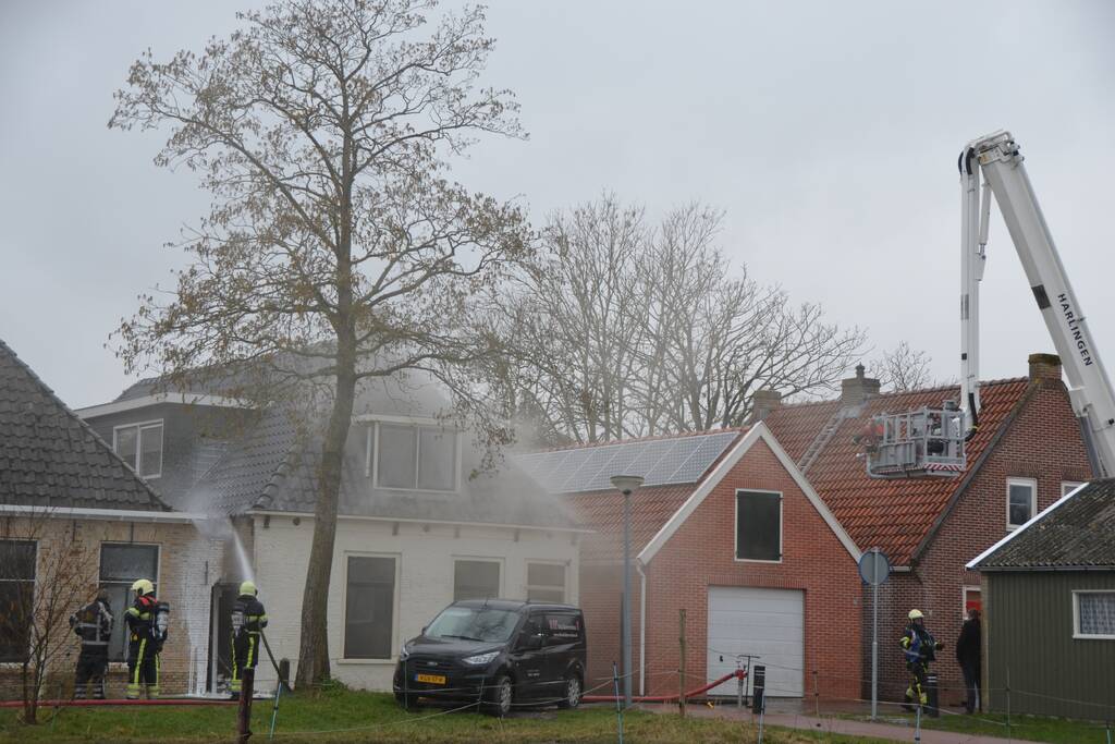 Woning vol rook bij brand