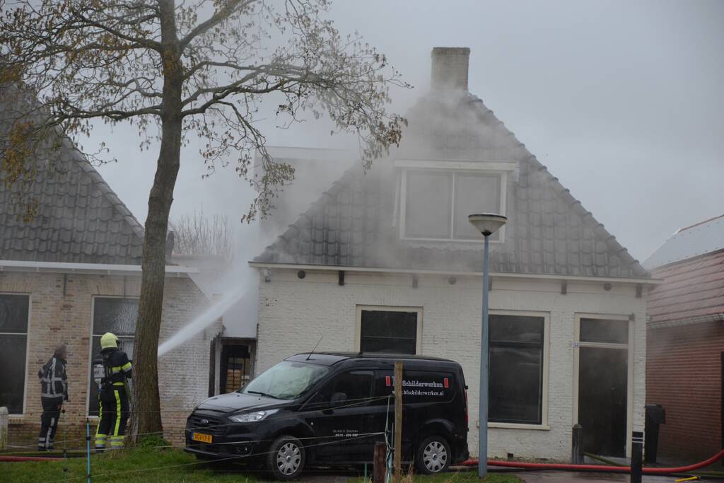 Woning vol rook bij brand