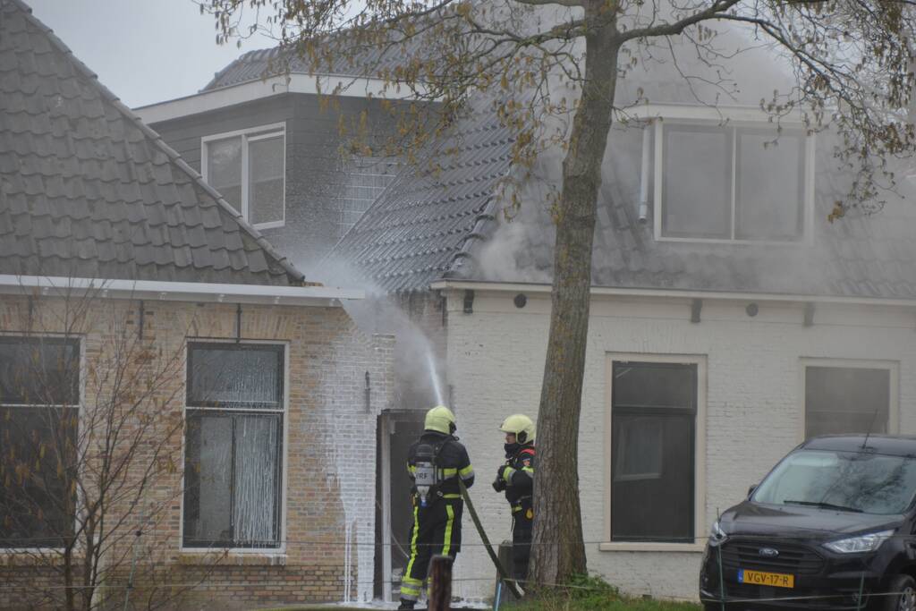 Woning vol rook bij brand