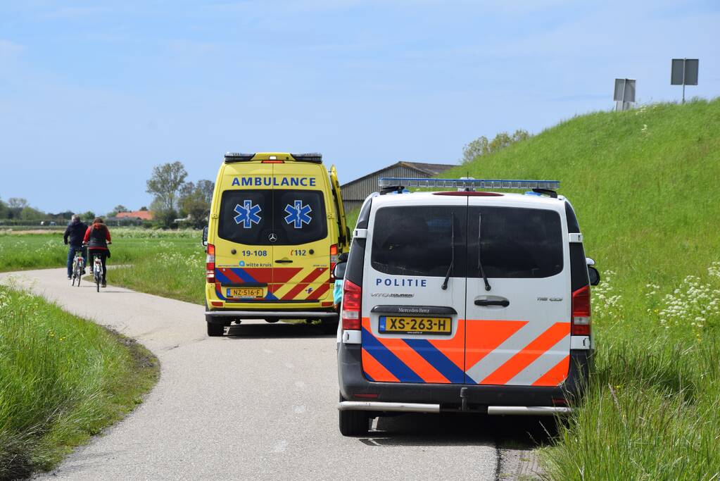 Persoon ten val met scooter