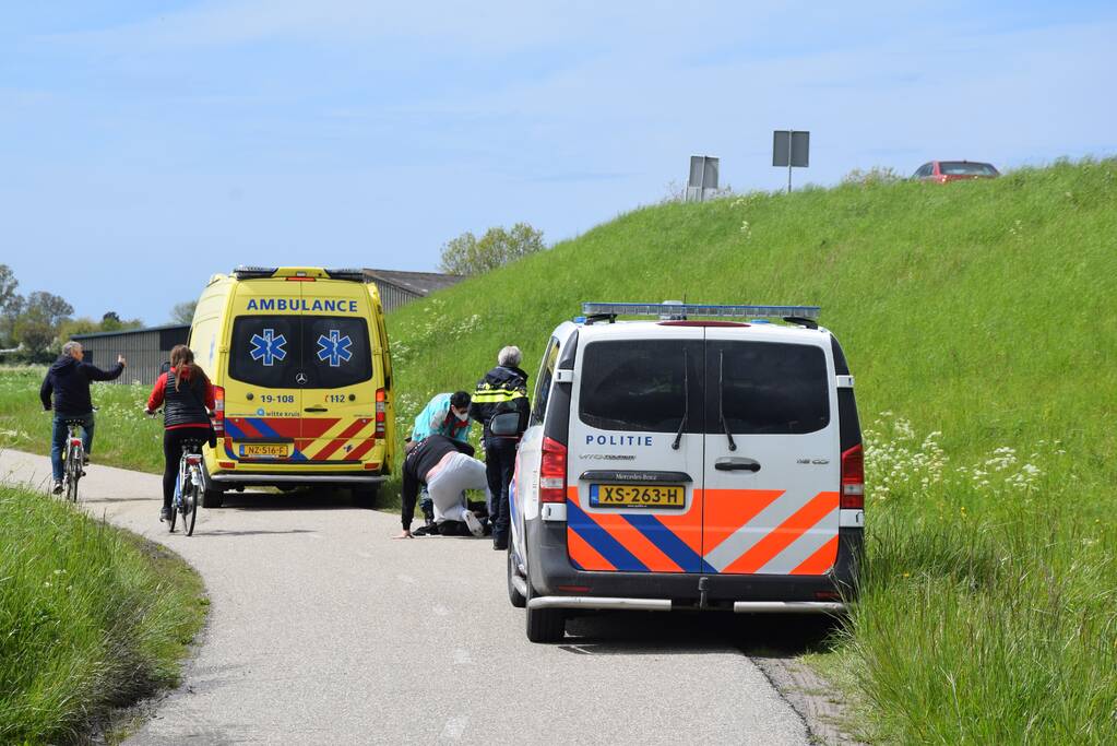 Persoon ten val met scooter