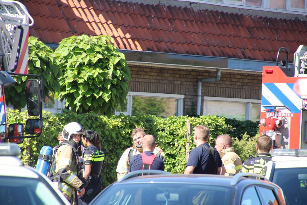 Grijze rookontwikkeling brand in woning