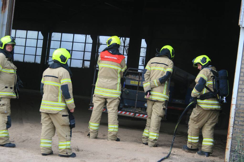 Zaagsel in brand in leegstaande loods