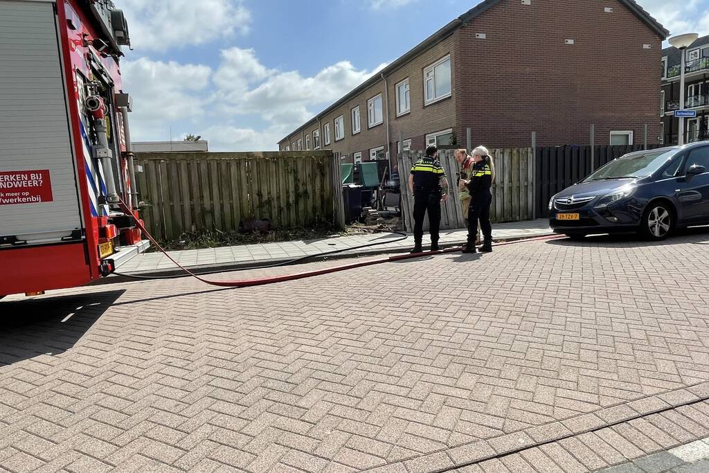 Schutting in achtertuin beschadigd door brand