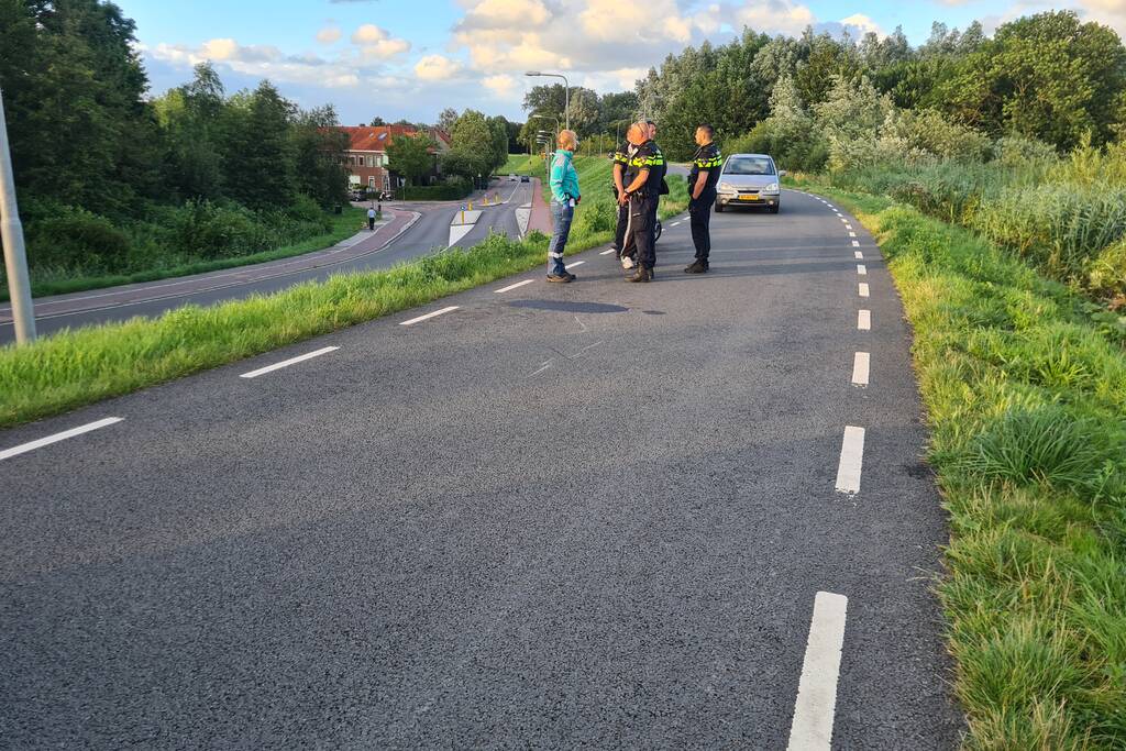 Persoon ten val met scooter