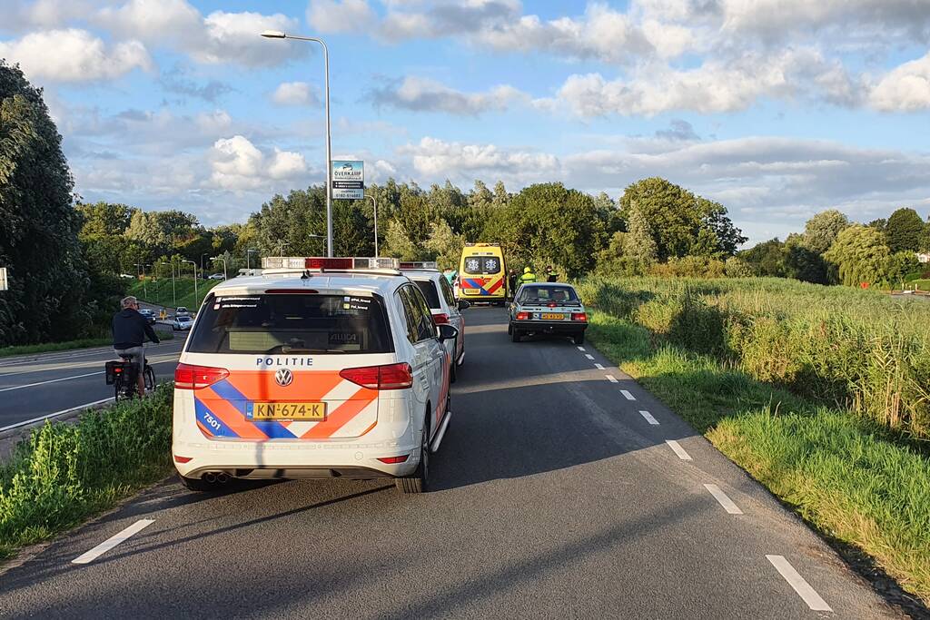 Persoon ten val met scooter