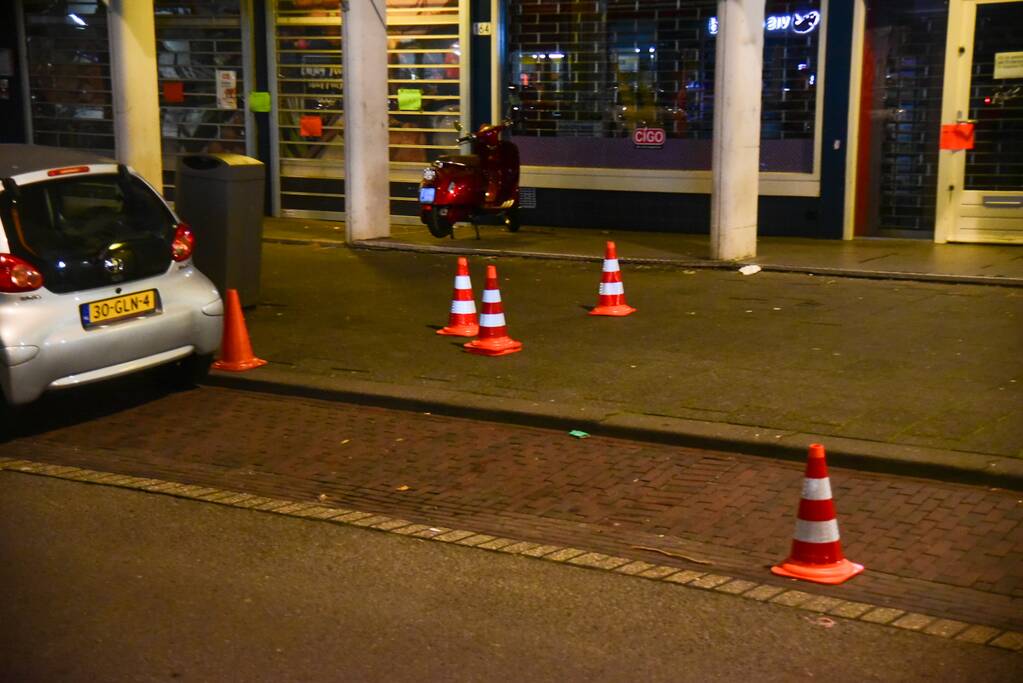 Schoten gelost op woning en winkelpand