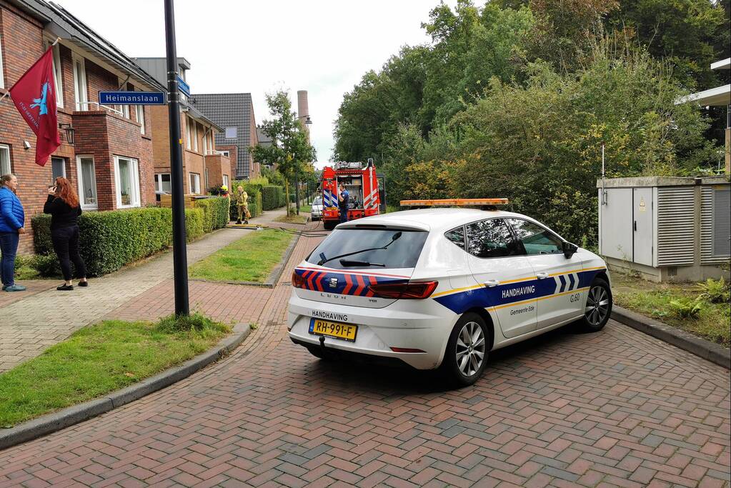 Brand in schuur naast woning