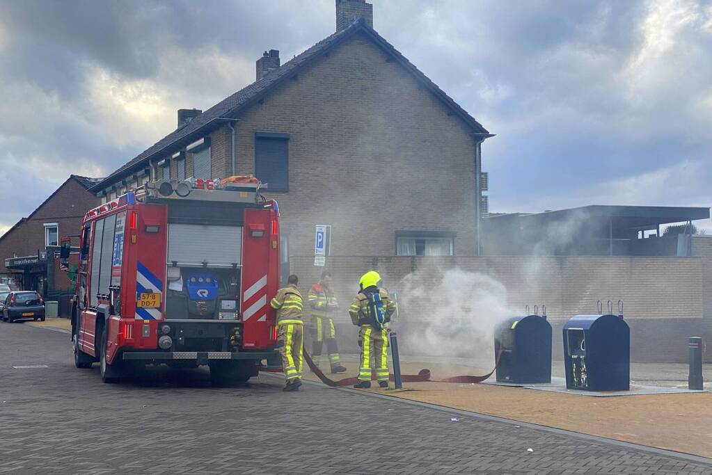 Ondergrondse container in brand
