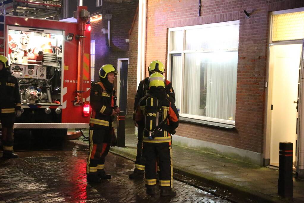 Rookontwikkeling door brand in schoorsteen van woning