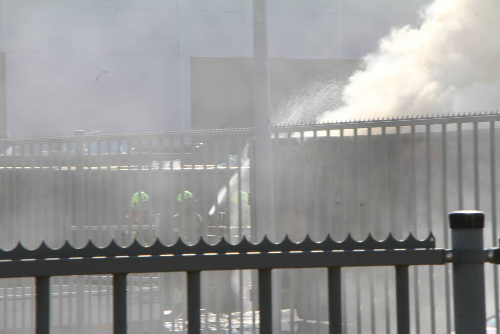 Forse rookontwikkeling bij brand in container