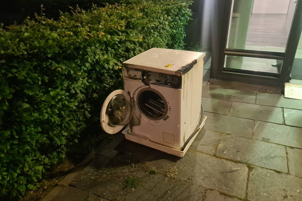 Brand in flat door wasmachine