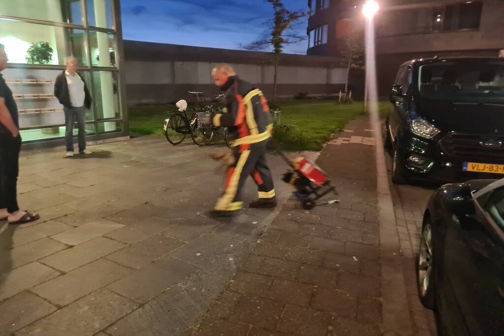 Brand in flat door wasmachine