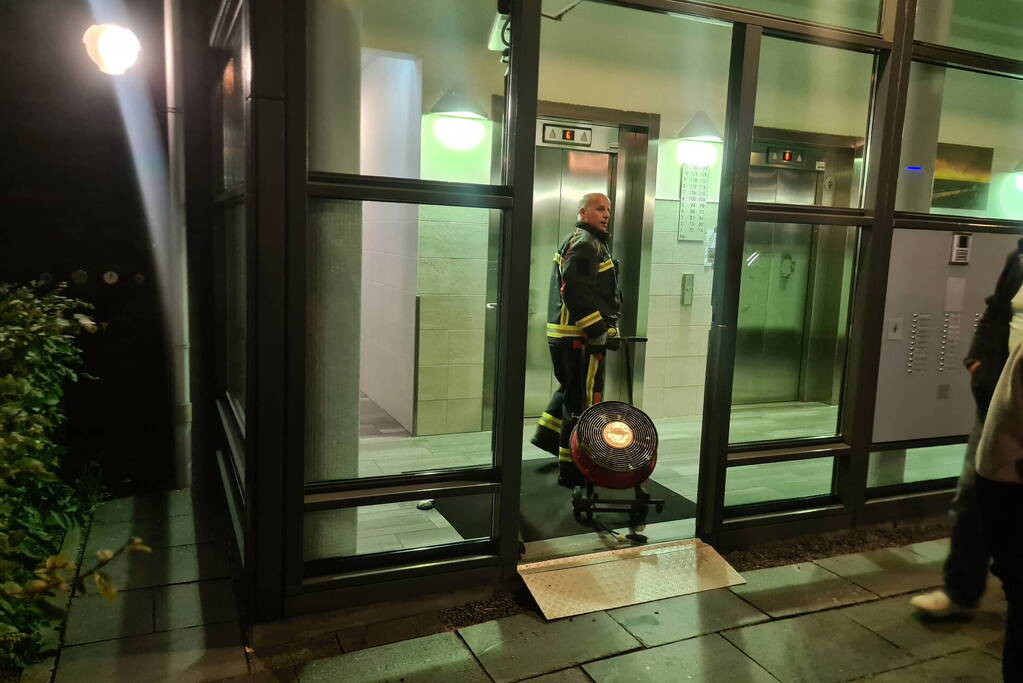 Brand in flat door wasmachine