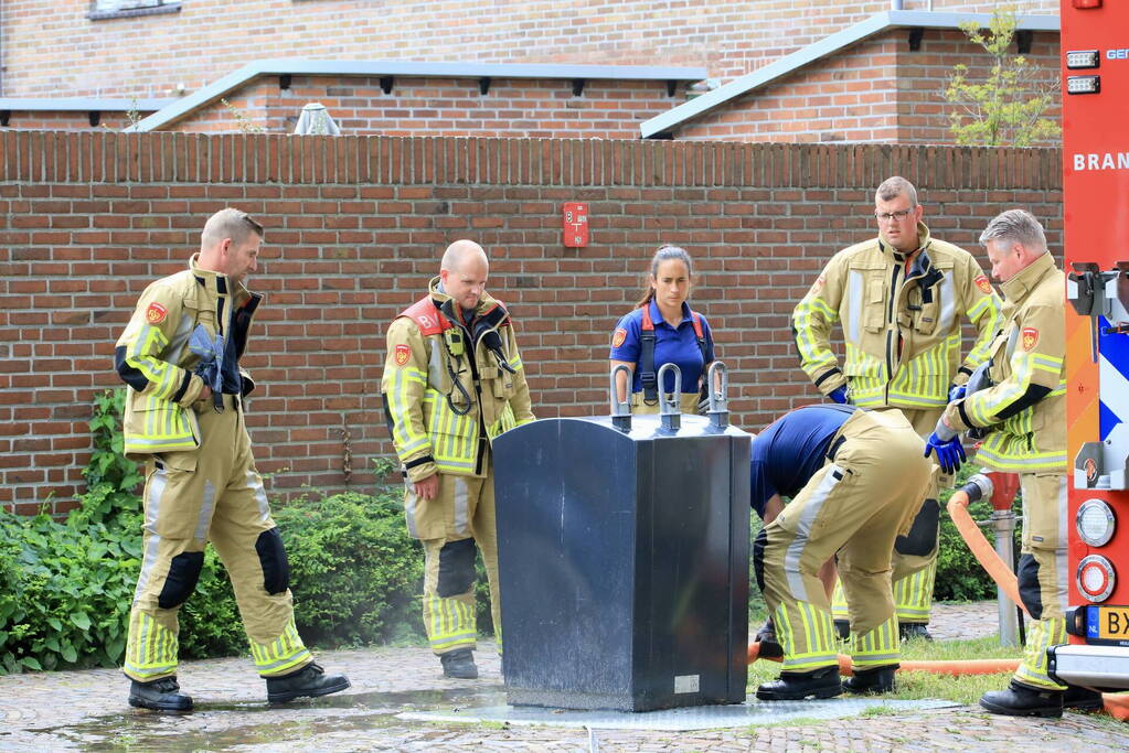 Ondergrondse container in brand