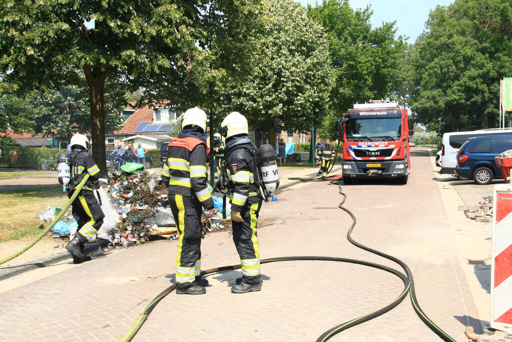 Lading vuilniswagen vat vlam