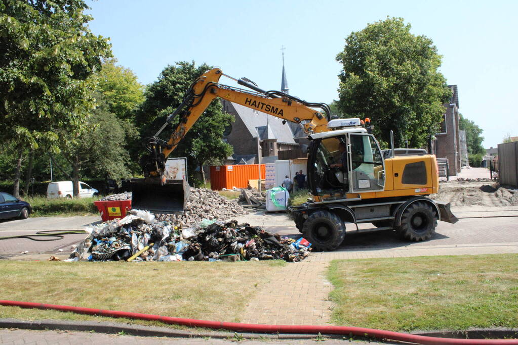 Lading vuilniswagen vat vlam