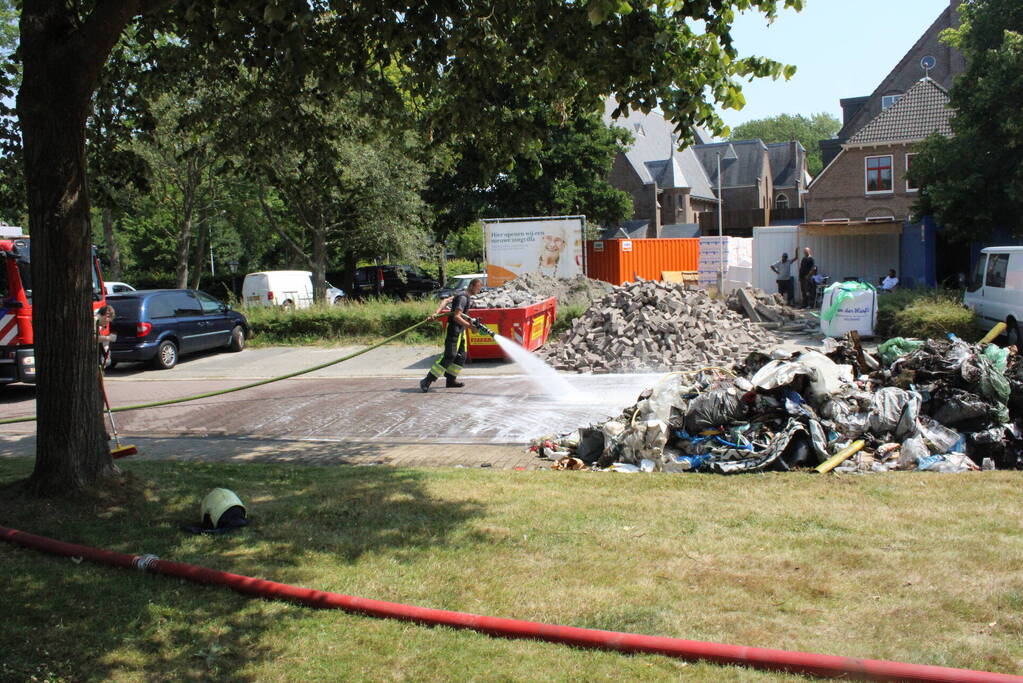 Lading vuilniswagen vat vlam