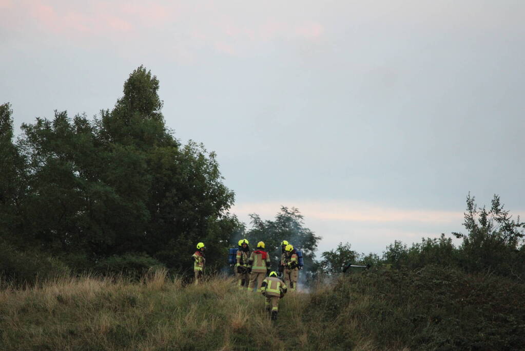 Pallets boven op berg in brand gevlogen