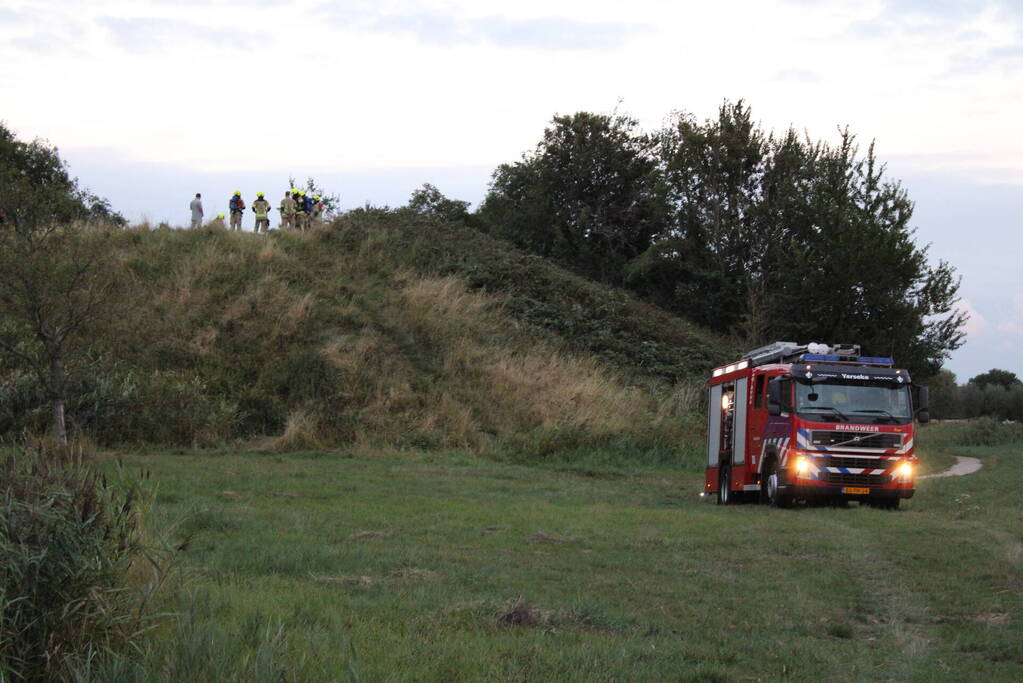 Pallets boven op berg in brand gevlogen
