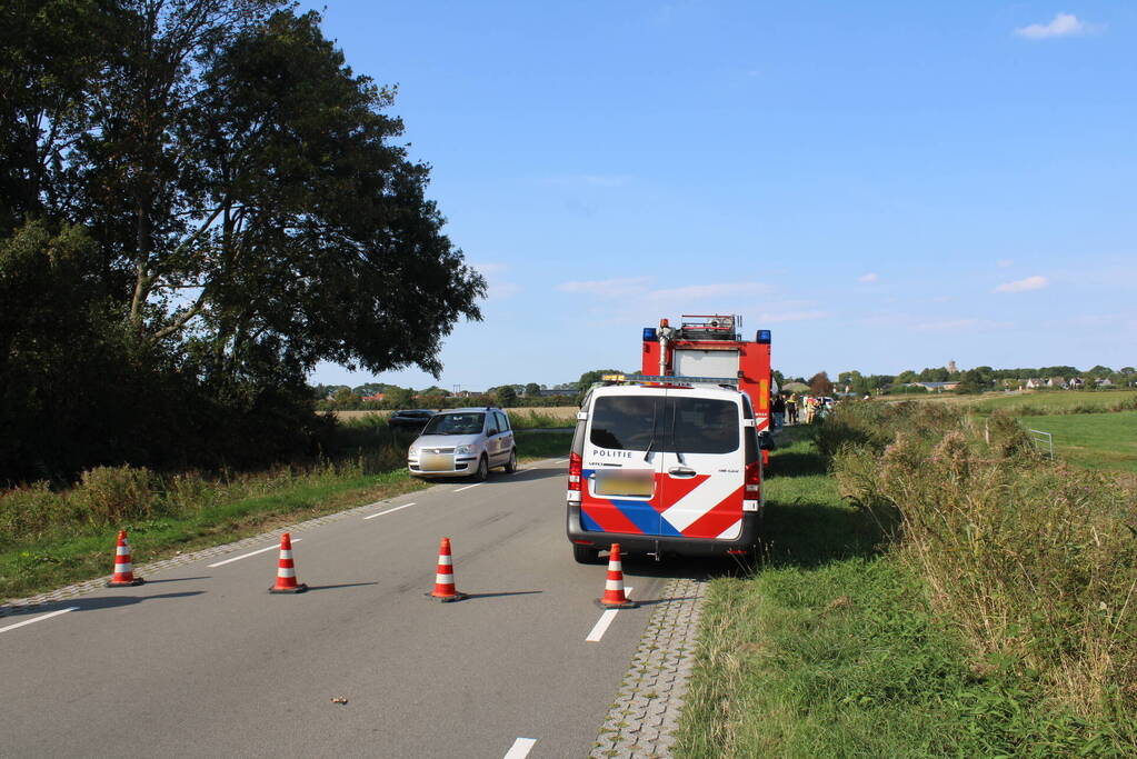 Scootmobiel en racefietser botsen op elkaar