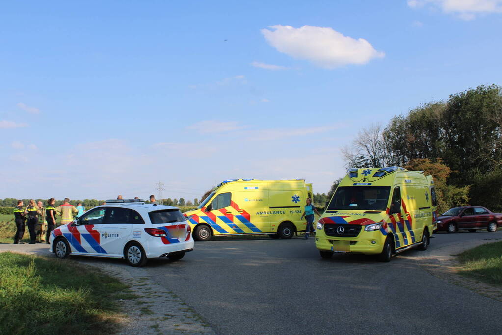 Scootmobiel en racefietser botsen op elkaar