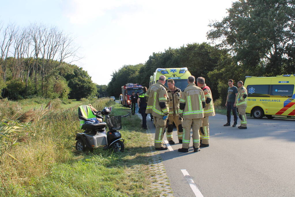 Scootmobiel en racefietser botsen op elkaar