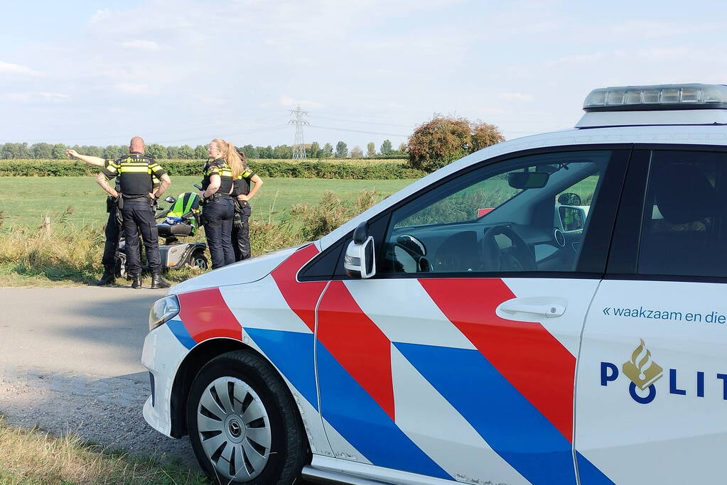Scootmobiel en racefietser botsen op elkaar