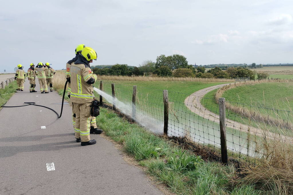 Afrastering beschadigd vanwege brand