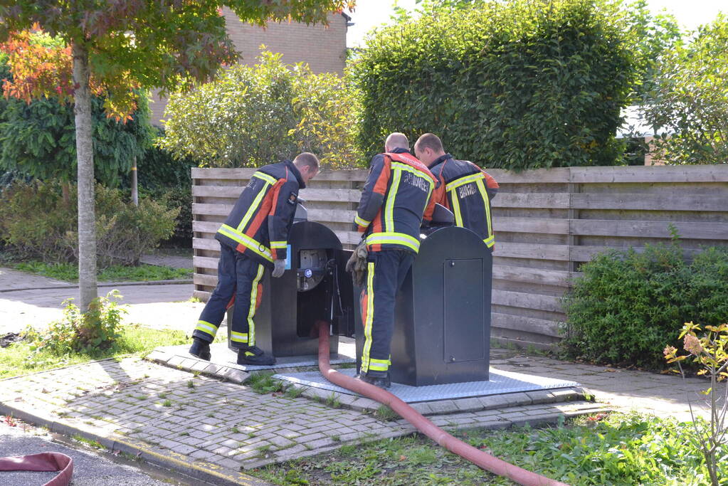 Ondergrondse container in brand