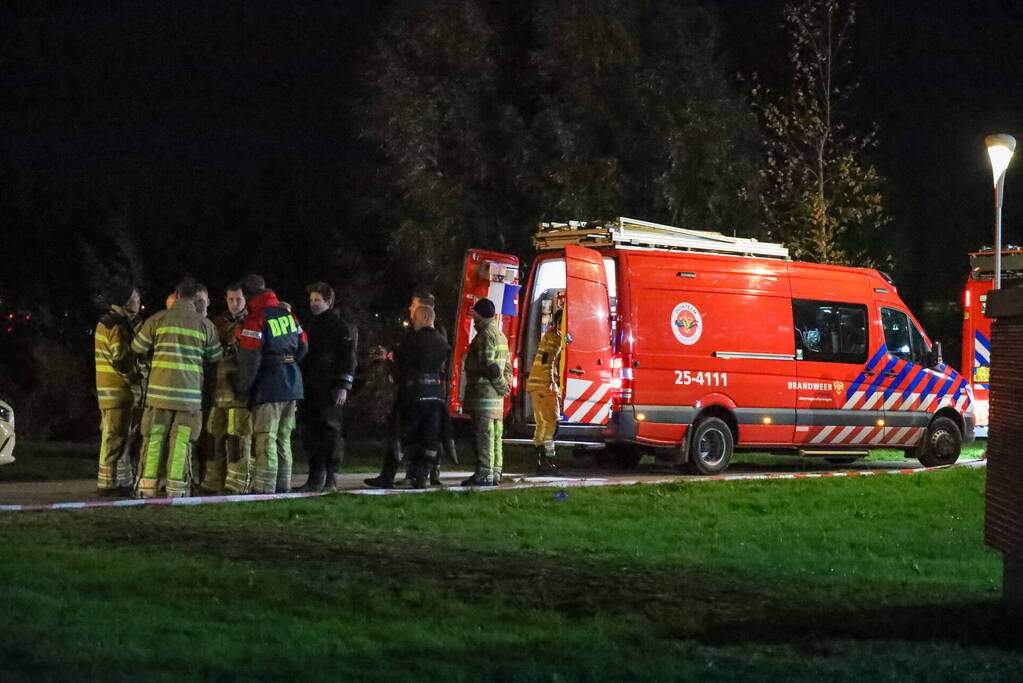 Persoon te water bij Albert Heijn supermarkt