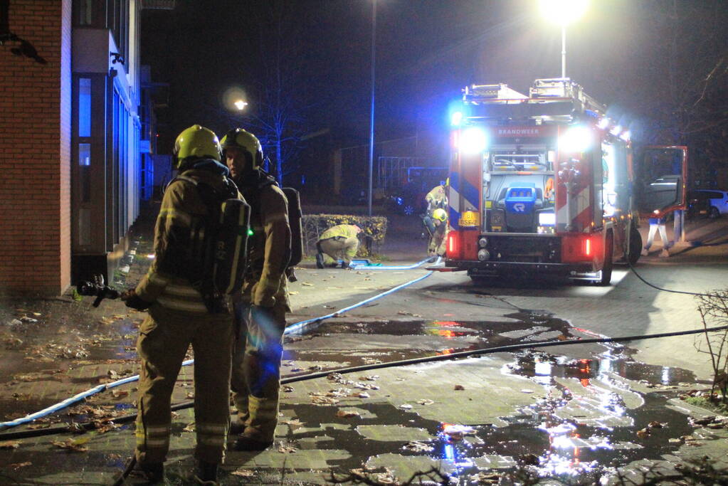 Brand in container tegen pand